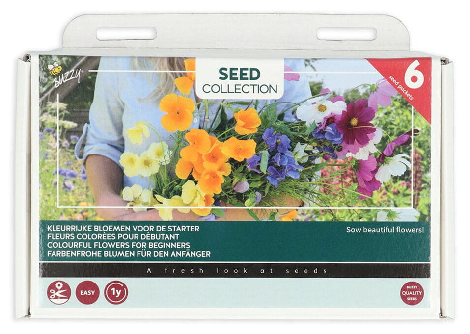 Blomsterblandning ‘Colourful Flowers for Beginners’ -förpackningens framsida, kuusi kukkalajia, nimikyltit och lyijykynä.